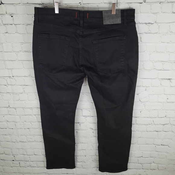 GUESS | Vermont slim fit low rise tapered leg jeans - Picture 2 of 9